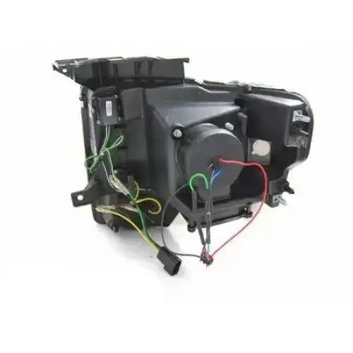 Hovedlys Ford F150 Mk12 08-14 Tube Light Chrome bakside med synlige ledninger og tilkoblinger.