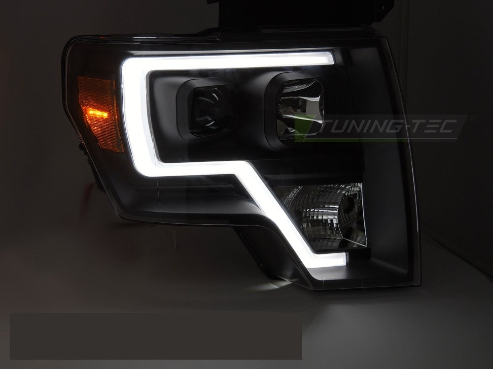 Nærbilde av tube light frontlykter i svart til Ford F150 MK12 2008–2014