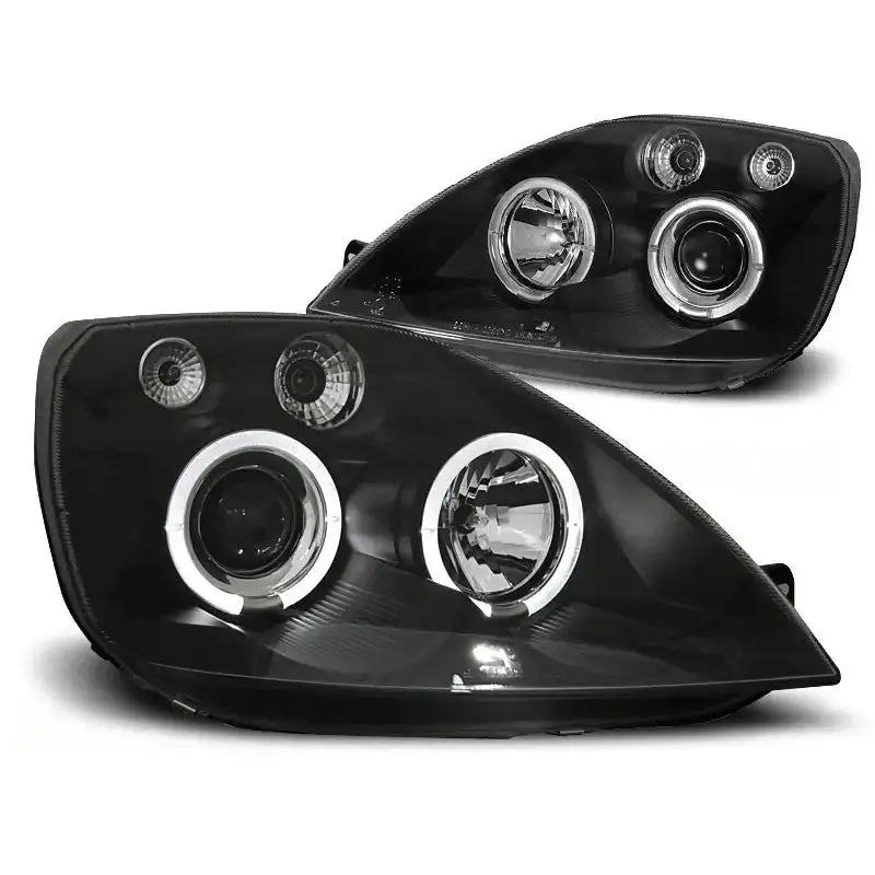 Hovedlykter Ford Fiesta MK6 Angel Eyes Black med doble runde lys og LED-ringer, vist fra skrå vinkel.