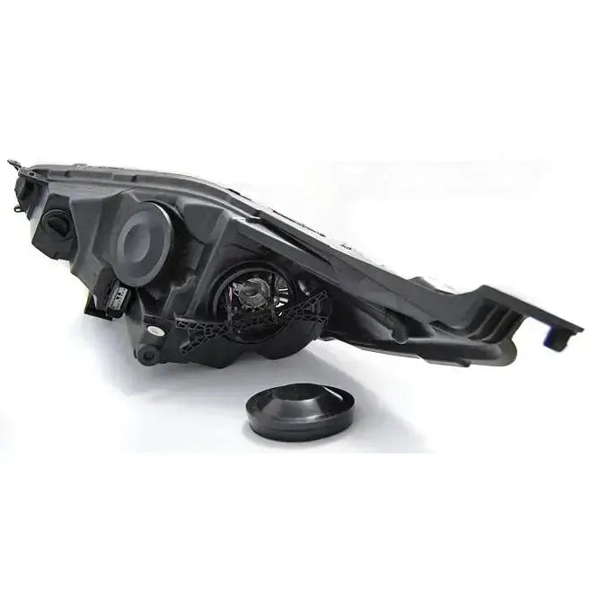 Headlights Ford Fiesta MK7 13- LED DRL Black vist bakfra med synlige interne komponenter og løs deksel.