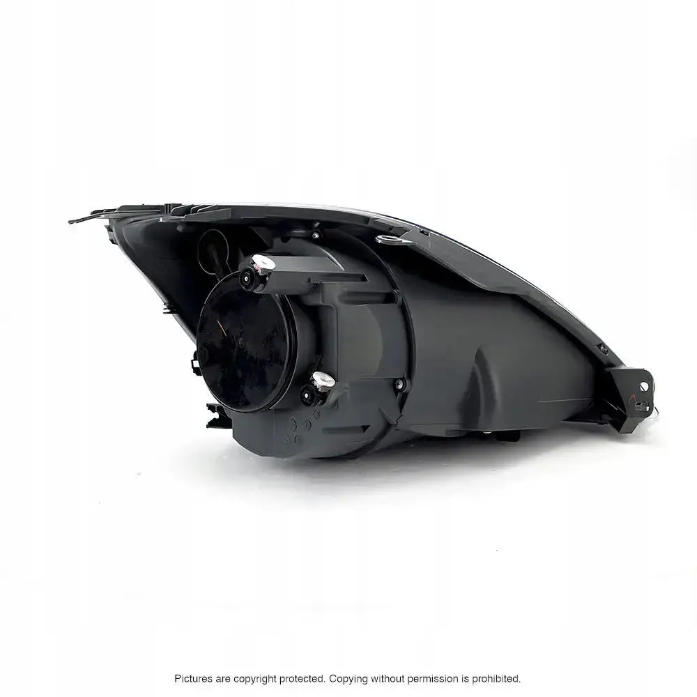 Headlamp Ford Fiesta V MK6 05-08 sett bakfra med synlige festepunkter og koblingselementer.