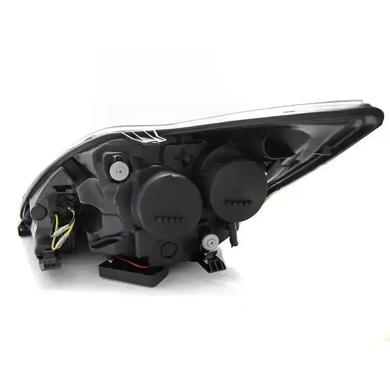 Hovedlys Ford Focus II Angel Eyes CCFL Black sett bakfra med ledninger, justeringsskruer og to runde deksler.