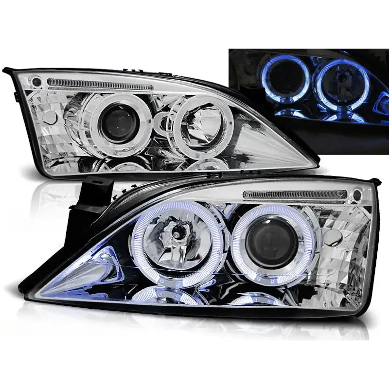 Frontlykter Ford Mondeo Angel Eyes Chrome med klart glass og blå LED-lysring, sett fra skrå vinkel.