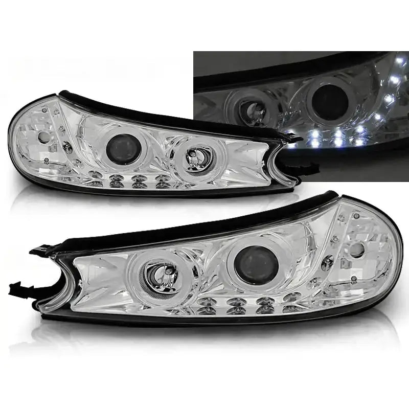 Frontlykter Ford Mondeo 10.96-08.00 Chrome med sorte kanter og integrerte LED-lys, vist fra skrå vinkel.