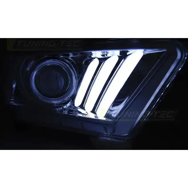Hovedlys Ford Mustang V 10-13 med tre hvite LED-striper i klart glass og moderne design.