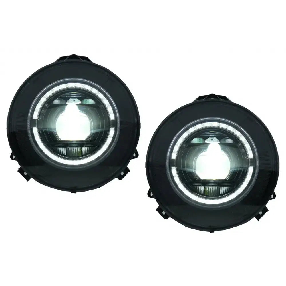 Frontlykter Full Led Mercedes G-Klasse W463, to runde sorte lykter med LED og hvit lysring.