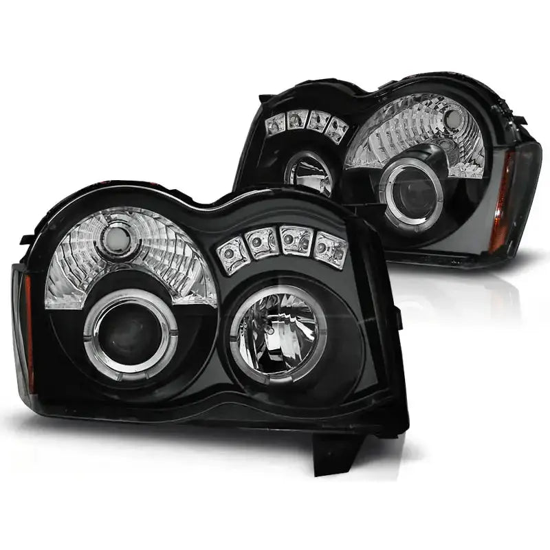 Hovedlykter Grand Cherokee 08-10 Angel Eyes Black med sort hus, klare linser og LED-elementer.