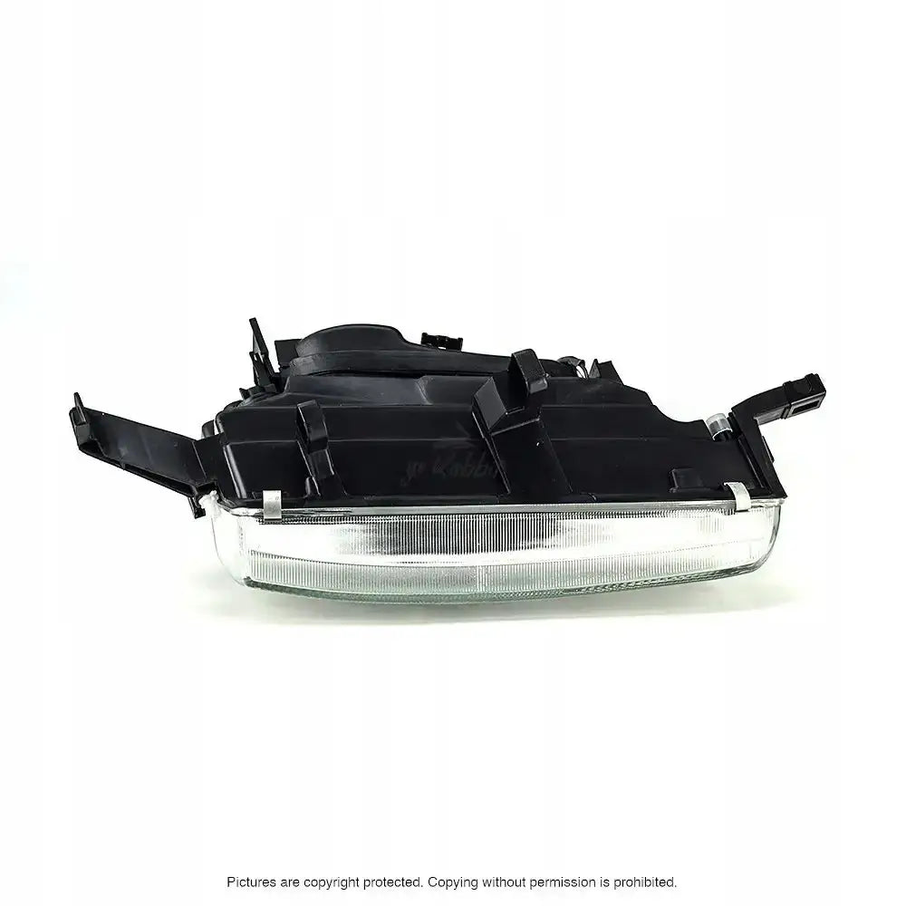 Hovedlykter Honda Accord 93-95 H1 vist fra siden med sort plast og klar linse, festedetaljer synlige.