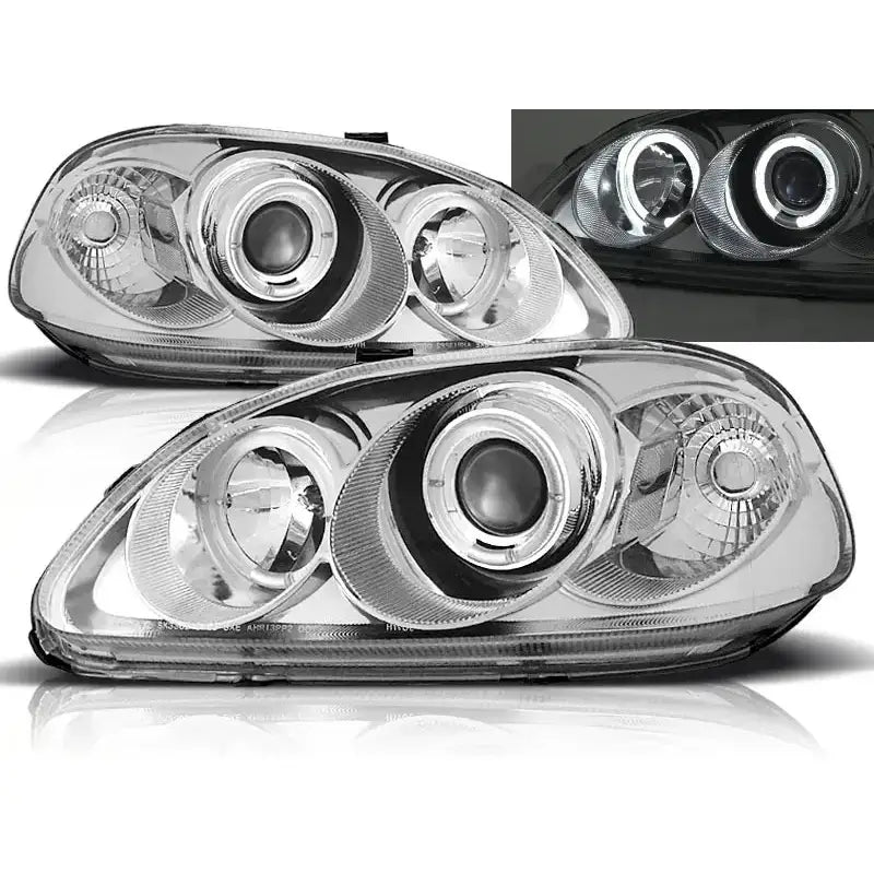 Frontlykter Honda Civic Angel Eyes Chrome med klart glass og kromdetaljer, tent i mørket.