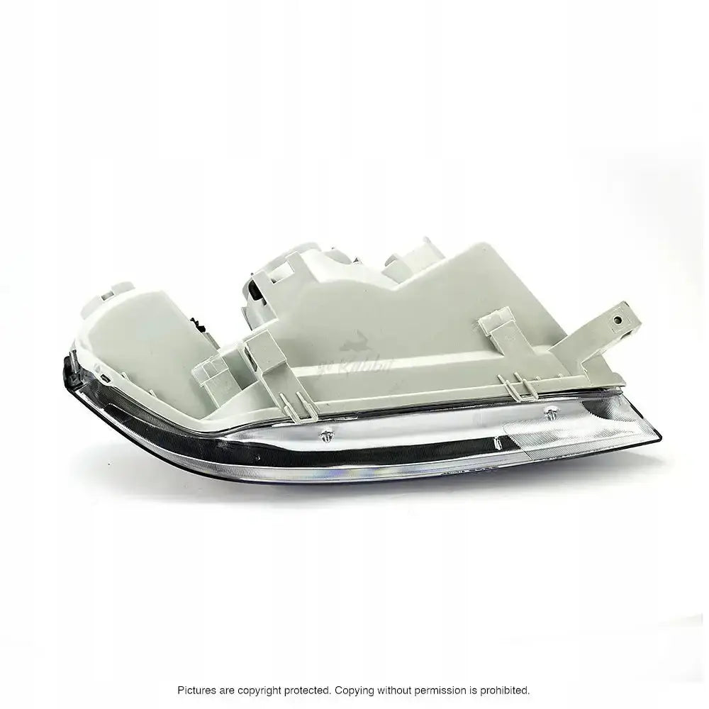 Hovedlykter Honda Civic 6 97-01 H4 sett fra skrå bakside med detaljerte festeanordninger.