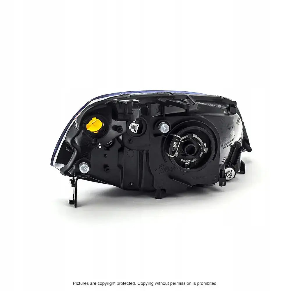 Hovedlys bakside av Honda Civic 7 01-03 frontlykt med gul plugg og synlige skruefester.