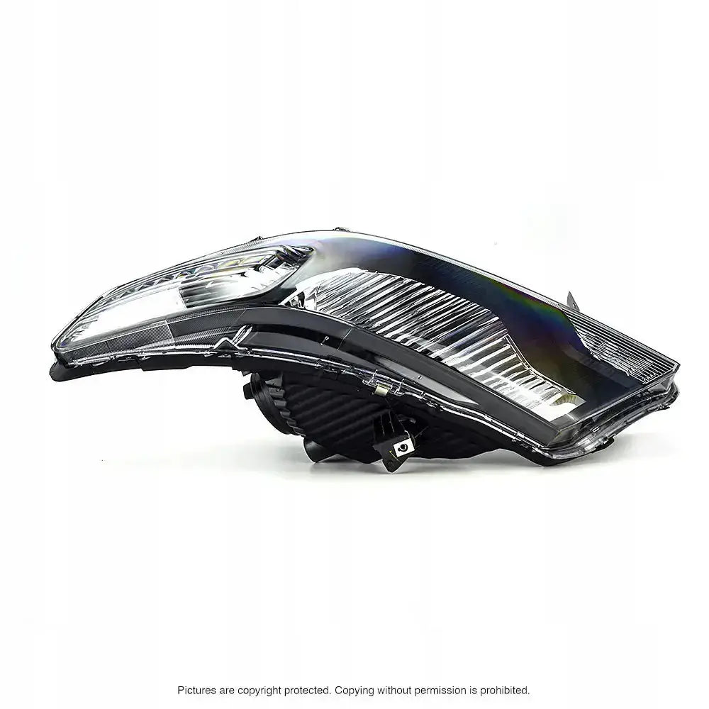 Frontlykter Honda CR-Z 10-13 sett fra siden med synlige reflektorer og detaljer i lampens indre.