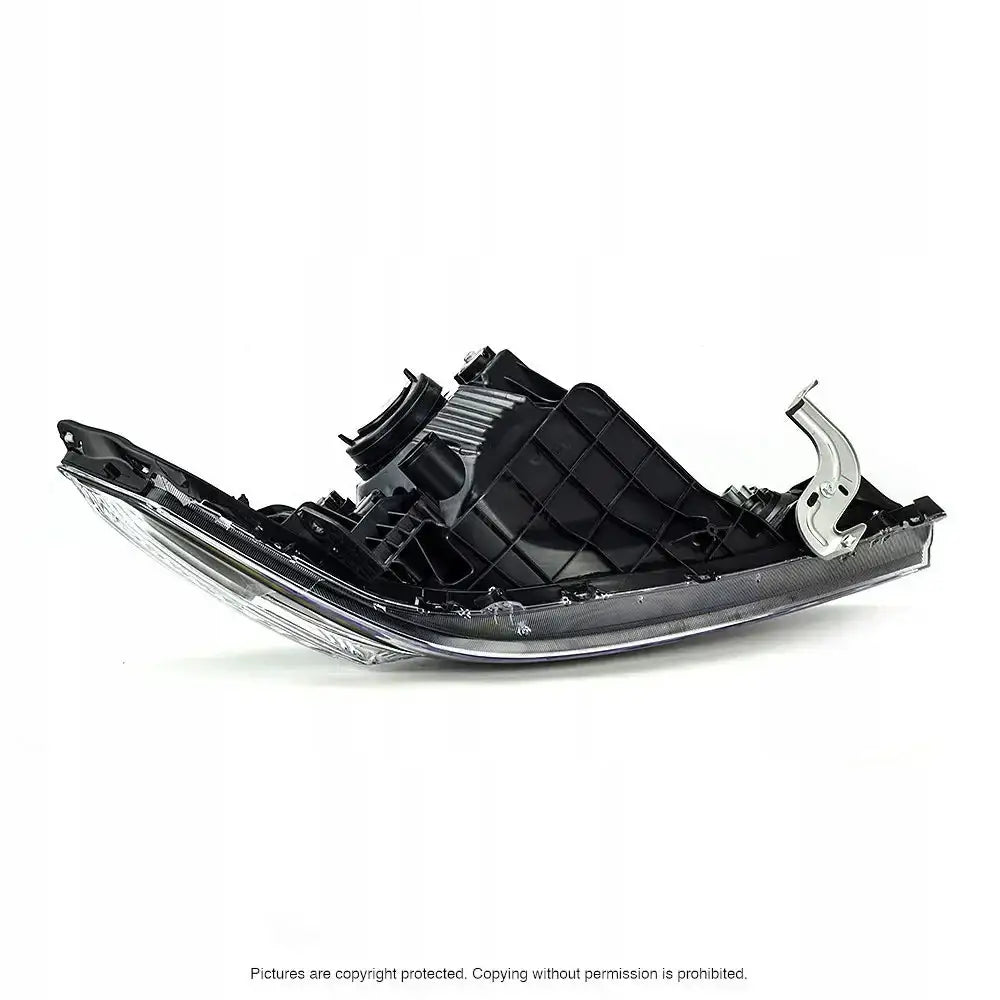 Hovedlykter Honda CR-Z 10-13 vist fra skrå bakside med sølvfarget metallbrakett på høyre side.