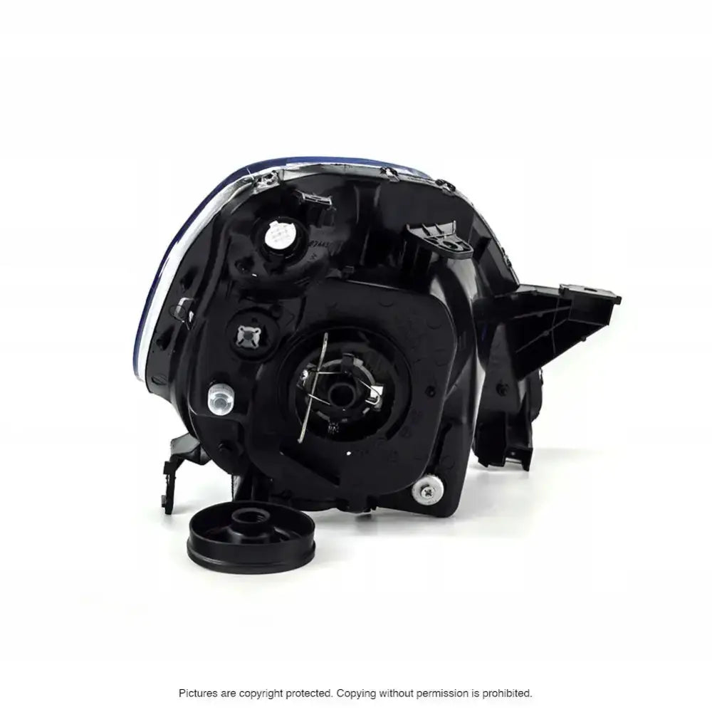 Headlamp bakside av Honda CRV 01-04 frontlykt med synlige kontakter og festepunkter.