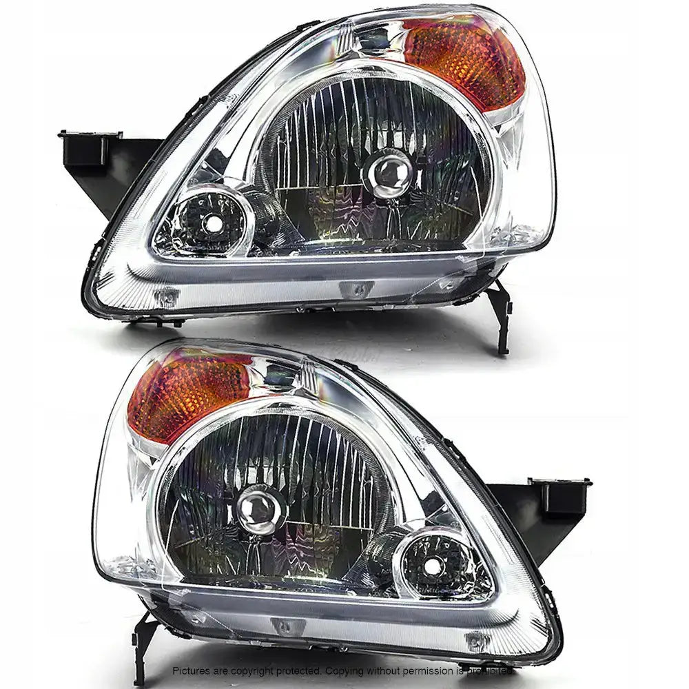Frontlykter Honda CRV 01-04 med klart glass, svarte og kromdetaljer, oransje blinklys øverst.