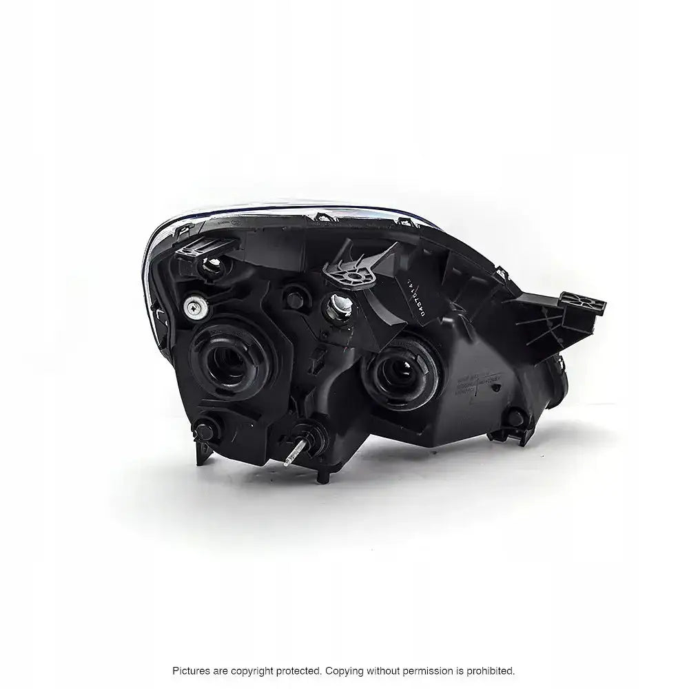 Headlamp Honda CRV 05-06 bakside med synlige pærer og monteringsfester mot hvit bakgrunn.