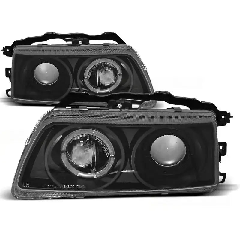 Hovedlykter Honda CRX 09.87-89 Angel Eyes Black med sorte hus og klare linser sett fra skrå vinkel.