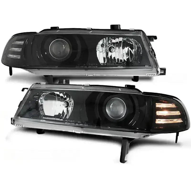 Frontlykter Honda Prelude Angel Eyes Black med LED-stripelys, sett forfra i sort plast og glass.