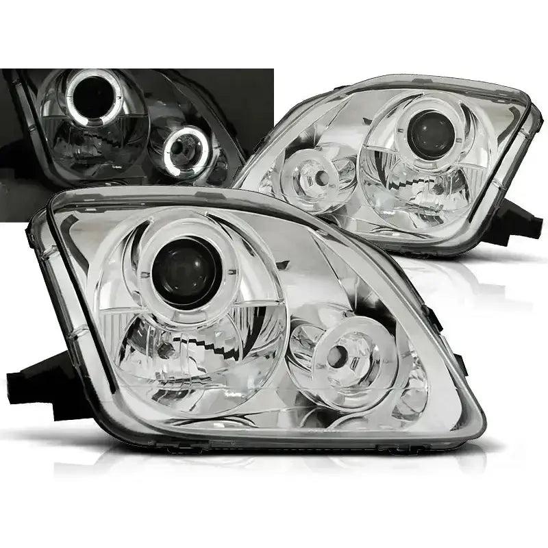 Frontlykter Honda Prelude 02.97-01 Angel Eyes Chrome med klart glass og kromdetaljer, sett fra skrå vinkel.