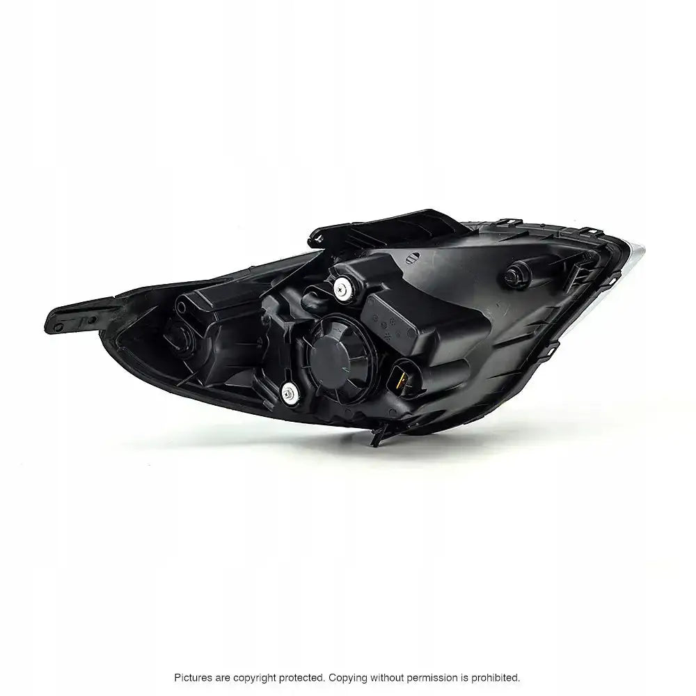 Headlamp bakside av Hyundai i20 frontlykt 08-12, sort plast med skruer og koblingspunkter.