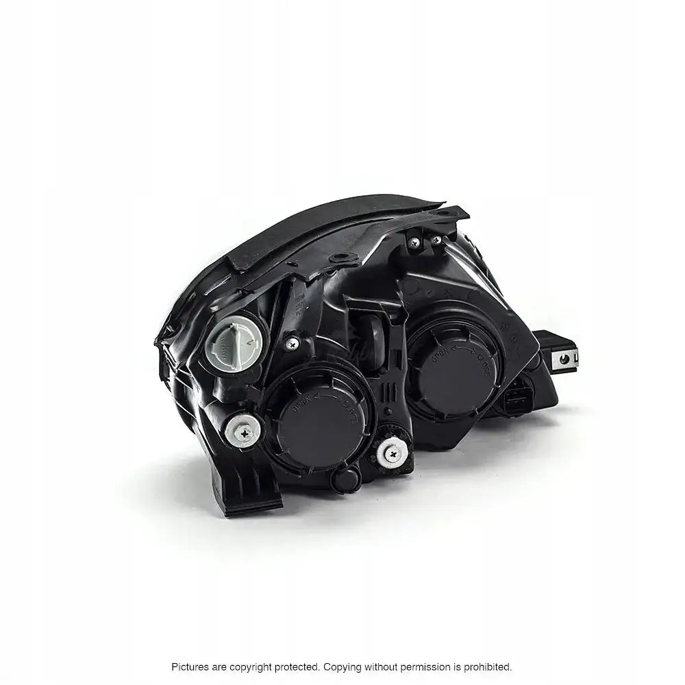 Headlights Hyundai i30 07-10 sett bakfra med to runde deksler og sølvskruer mot hvit bakgrunn.