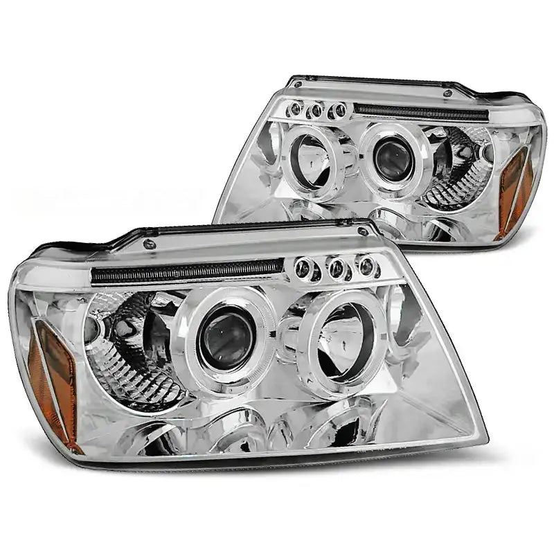 Frontlykter Jeep Grand Cherokee 99-05 Angel Eyes Chrome med runde linser og oransje detalj i hjørnet.