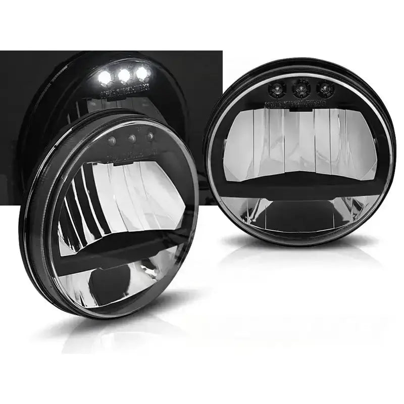 Frontlykter Jeep Wrangler JK 07-18 LED, to runde lykter med sorte hus og klare glass.
