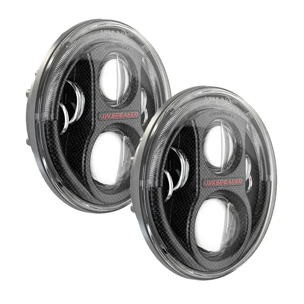 Frontlykter Led JW Speaker 8700 Evo J2 Carbon med klar linse og sort karboninnramming, sett skrått forfra.