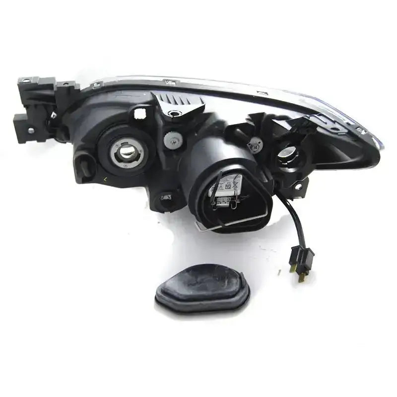 Headlights bakside av Mazda 3 03-09 Black Xenon med synlige ledninger, pæreholder og løs gummipakning.