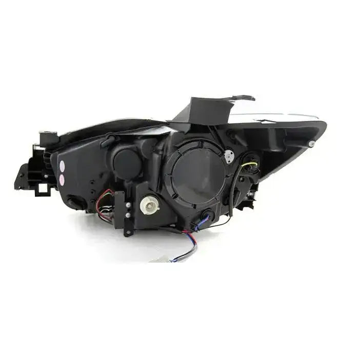 Headlamp bakside av Mazda CX5 11-15 black true DRL med ledninger og tilkoblingspunkter synlig.