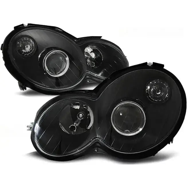 Frontlykter Mercedes CL203 C-Klasse 00-04 i svart plast med to runde linser og reflektorer.