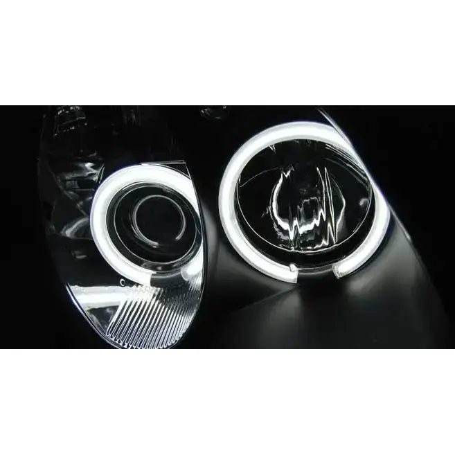 Hovedlys Mercedes R170 SLK Angel Eyes CCFL Black med hvite LED-lysringer og sort blank overflate.