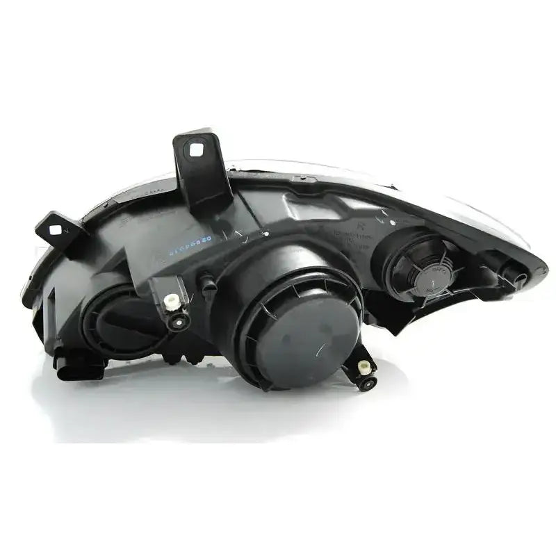 Headlamp bakside av Mercedes Vito W639 frontlykter med svarte deksler og monteringsfester.