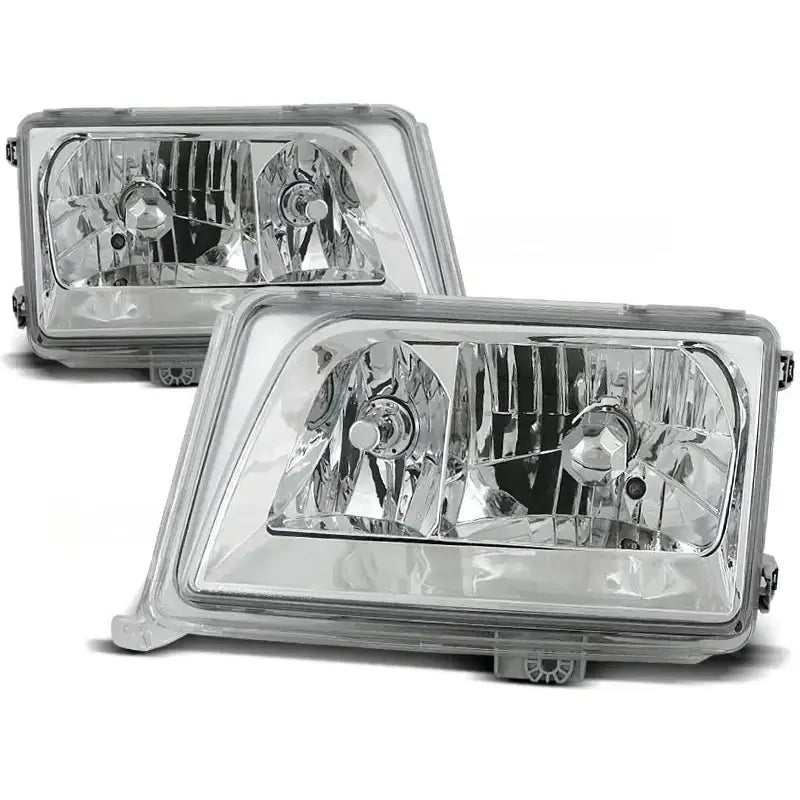 Frontlykter Mercedes W124 E-Klasse 05.93-06.95 i klart glass og krom, sett fra skrå forsidevinkel.