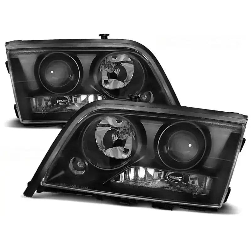 Frontlykter Mercedes W202 C-Klasse 06.93-06.00 i svart med klart glass og synlige kromdetaljer.