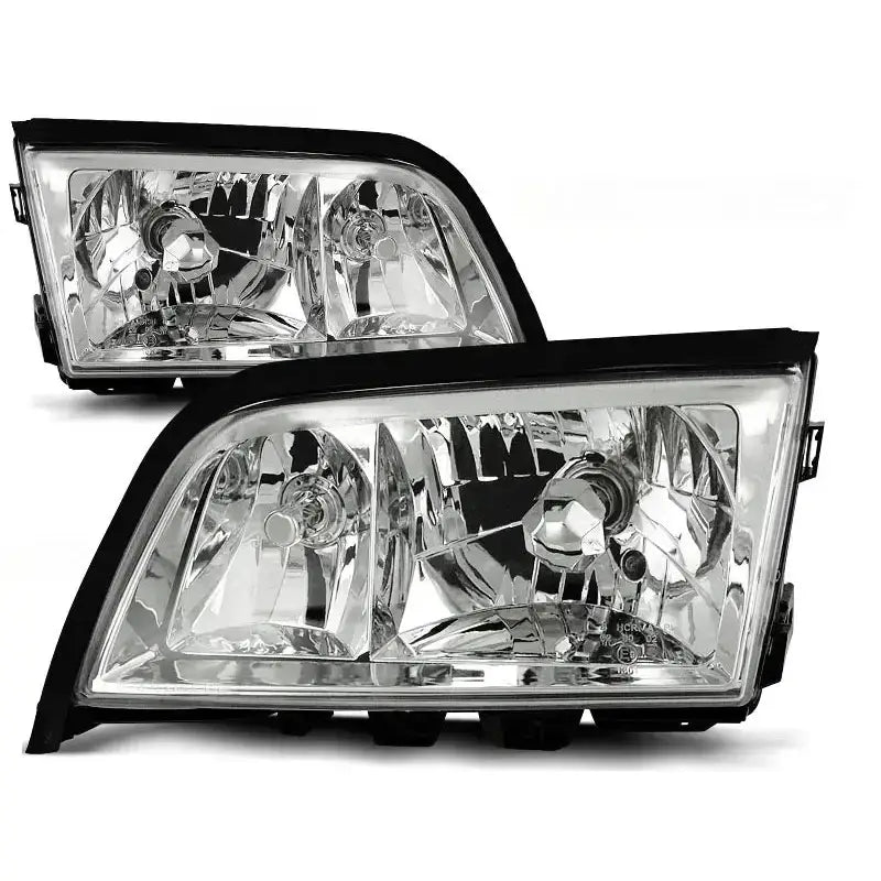 Frontlykter Mercedes W202 C-Klasse 06.93-06.00 i chrome, to rektangulære med svart kant, sett skrått forfra.