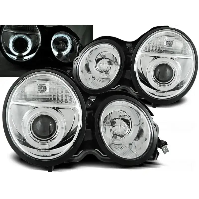 Frontlykter Mercedes W210 E-Klasse Angel Eyes Chrome sett forfra med klare glass og sølvfargede reflektorer.