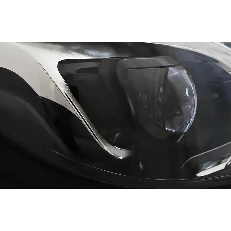 Frontlykter Mercedes W212 13-16 Black Led DRL nærbilde av svart deksel med synlige detaljer.