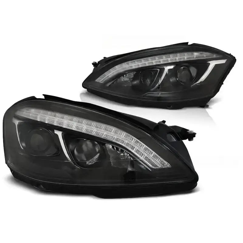 Hovedlykter Mercedes W221 05-09 Daylight HID Black med LED-striper, sett fra skrå vinkel.