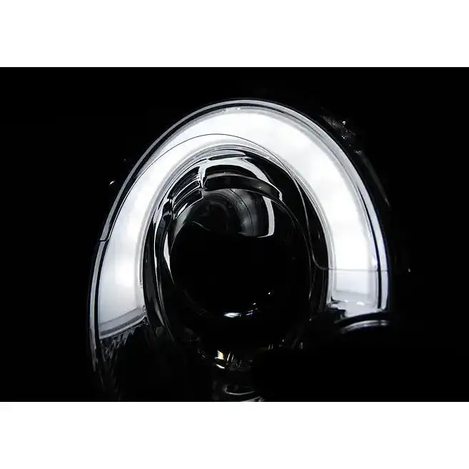 Hovedlys på Mini Cooper 06-14 PY21W Tube Light Black med rund LED-ring i klart glass.