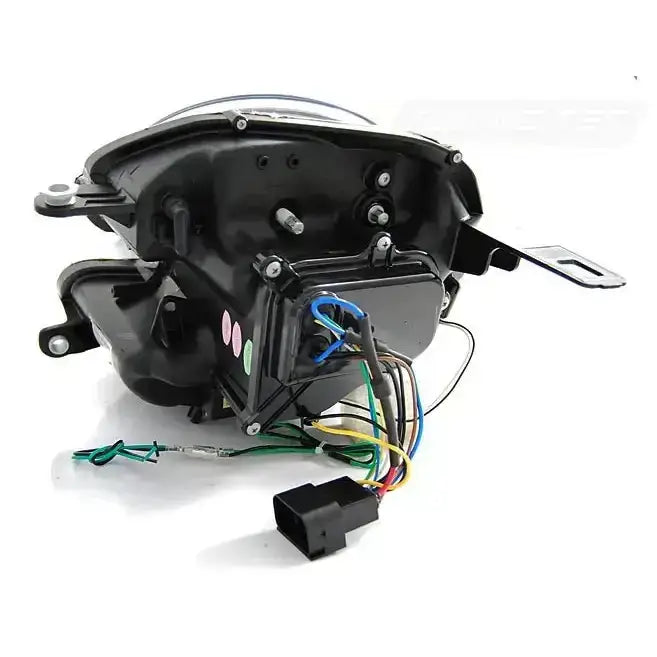 Headlights bakside av Mini Cooper 06-14 PY21W Tube Light Black med synlige ledninger og tilkoblingsplugg.