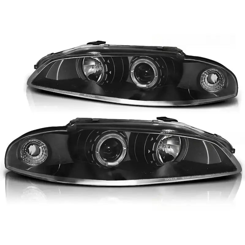 Hovedlykter Mitsubishi Eclipse Angel Eyes Black med to hovedlinser og klare reflektorer, sett forfra.