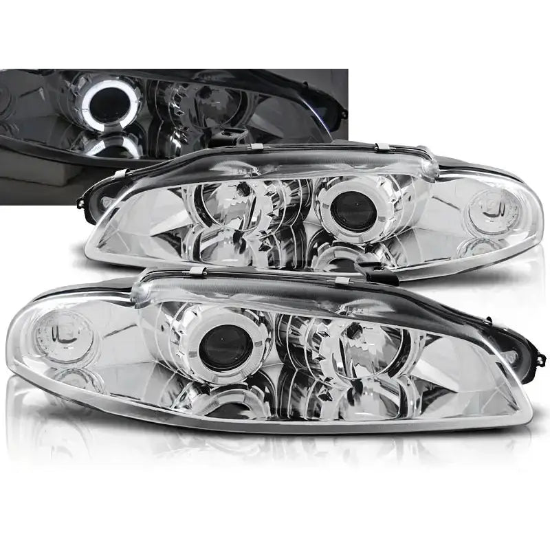 Frontlykter Mitsubishi Eclipse Angel Eyes Chrome med klart glass og rund projektorlinse, sett forfra.
