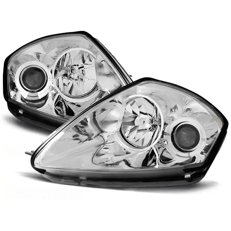 Hovedlykter Mitsubishi Eclipse D50 Angel Eyes Chrome, to klare lykter i glass og svart plast mot hvit bakgrunn.