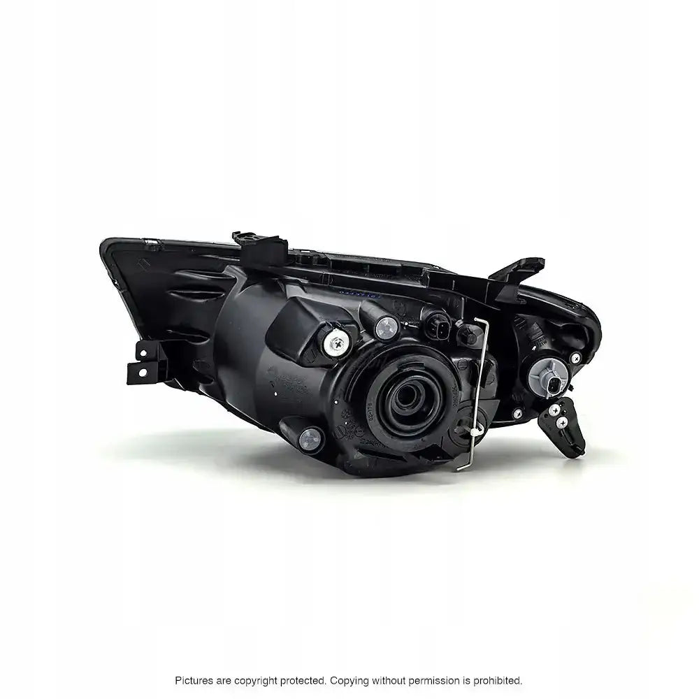 Headlamp bakside av Mitsubishi L200 frontlykt 05-10 med monteringspunkter, skruer og sirkulær åpning.