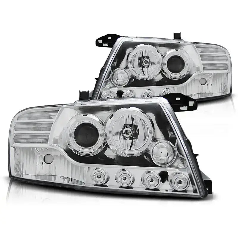 Hovedlykter Mitsubishi Pajero V60 00-06 Angel Eyes Chrome sett skrått forfra med runde lamper.