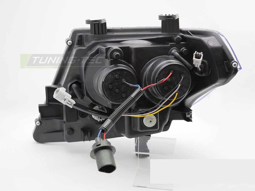 Nissan Frontier frontlykter svart hus med LED tube-design montert