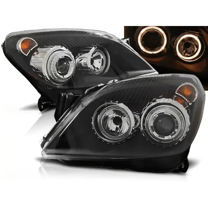 Frontlykter Opel Astra H Angel Eyes Black med runde linser og oransje blinklys, lysringer tent.