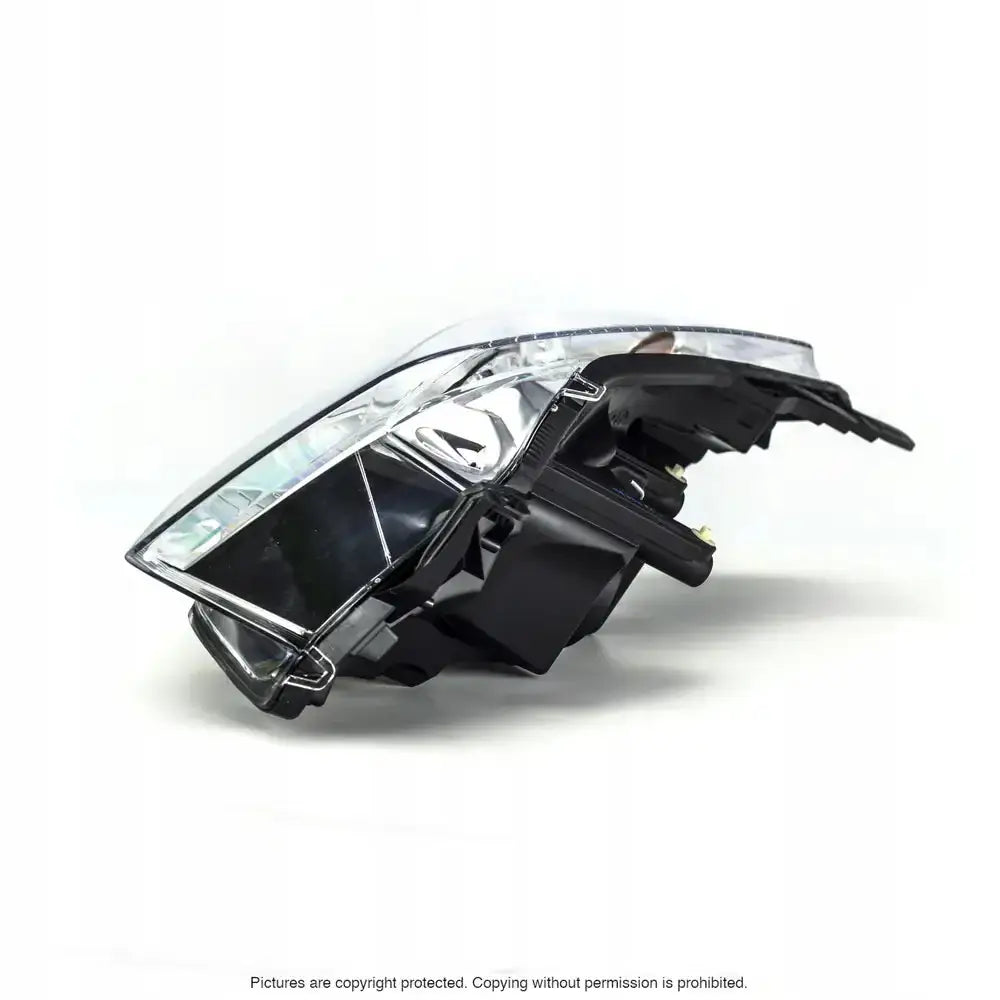 Headlights Opel Astra H 07-10 H7 sett fra siden med synlige detaljer og monteringspunkter.