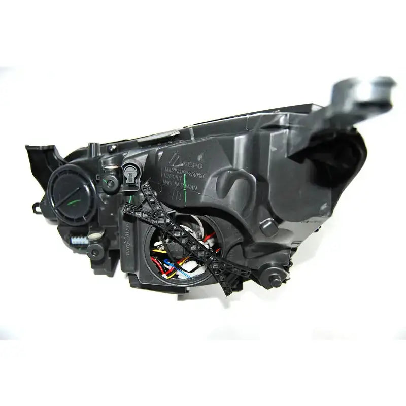Hovedlys Opel Astra J 10- Chrome Tru DRL bakside med synlige ledninger og tekniske detaljer.